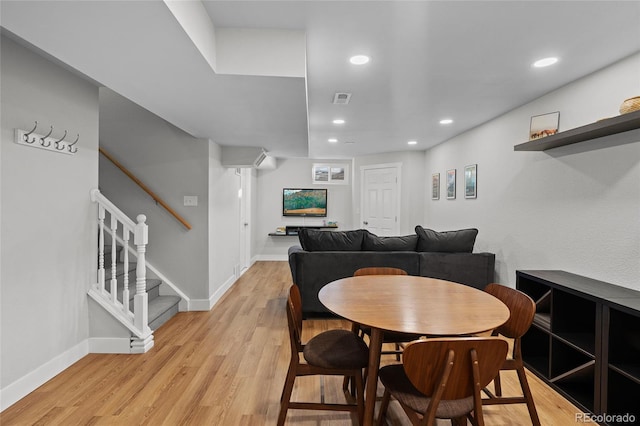 dining area with light hardwood / wood-style floors