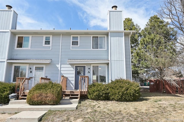 townhome / multi-family property with a chimney