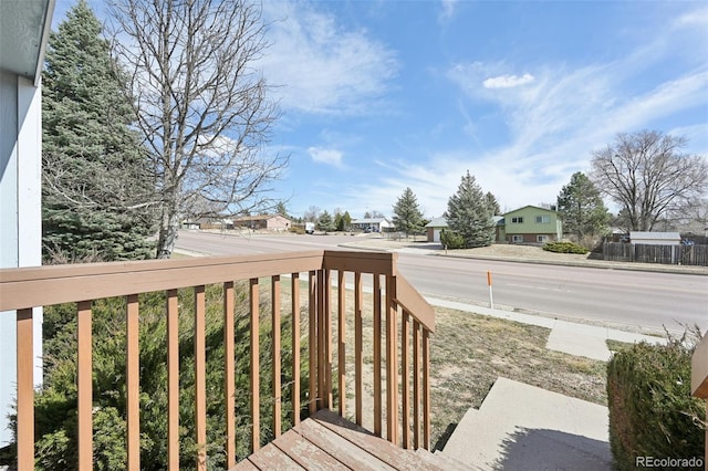 wooden deck featuring a residential view