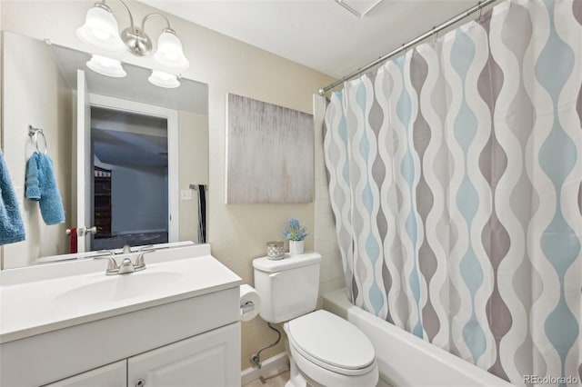 bathroom featuring toilet, vanity, and shower / bath combination with curtain