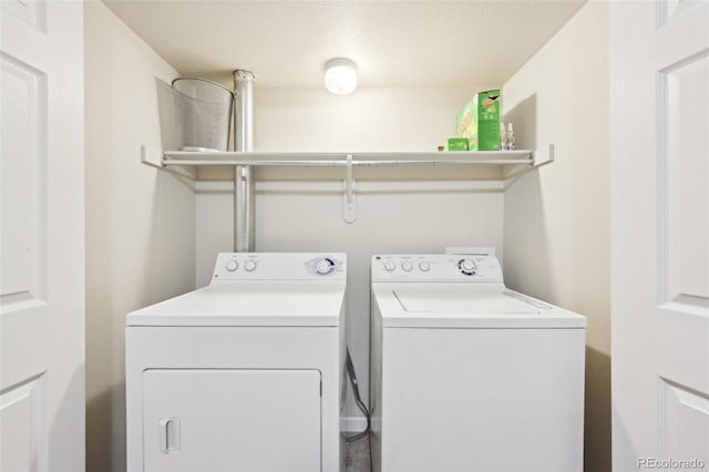 laundry room with washer and dryer and laundry area