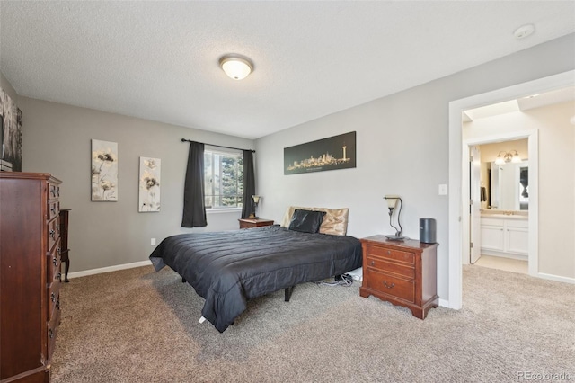 carpeted bedroom with baseboards and a textured ceiling