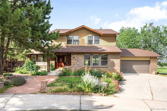7603 W Coal Mine Pl, Littleton, CO 80128 - traditional-style house with driveway, an attached garage, brick siding, and a shingled roof