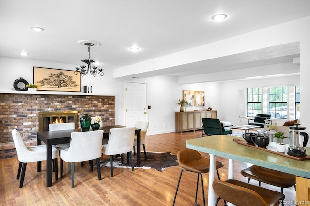 7603 W Coal Mine Pl, Littleton, CO 80128 - dining area with light wood finished floors, recessed lighting, and a chandelier