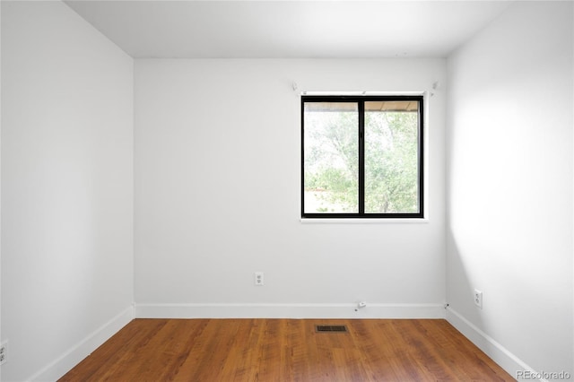 7603 W Coal Mine Pl, Littleton, CO 80128 - spare room with baseboards and wood finished floors