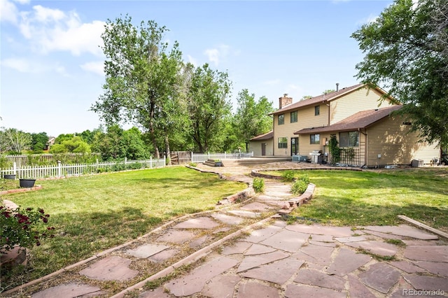 7603 W Coal Mine Pl, Littleton, CO 80128 - fenced backyard featuring a patio