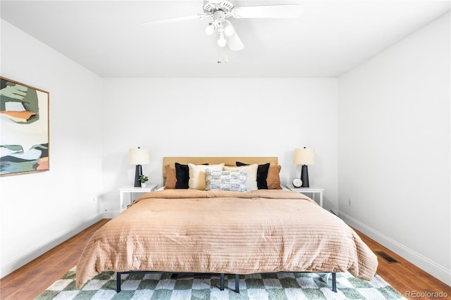 7603 W Coal Mine Pl, Littleton, CO 80128 - bedroom with wood finished floors and a ceiling fan