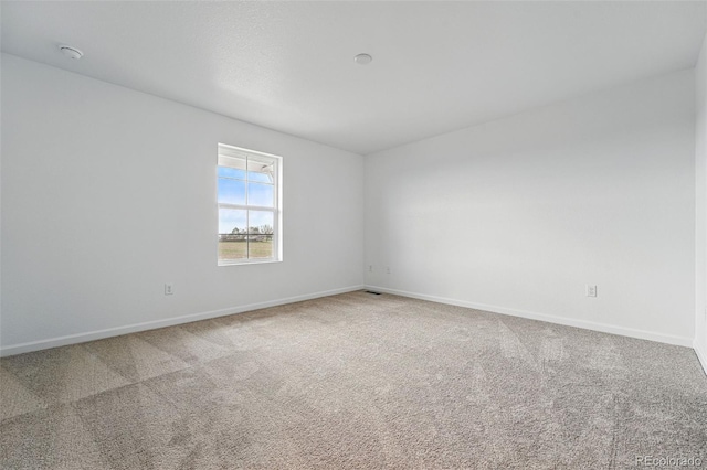 2116 Chambers Rd, Brighton, CO 80601 - carpeted spare room featuring baseboards