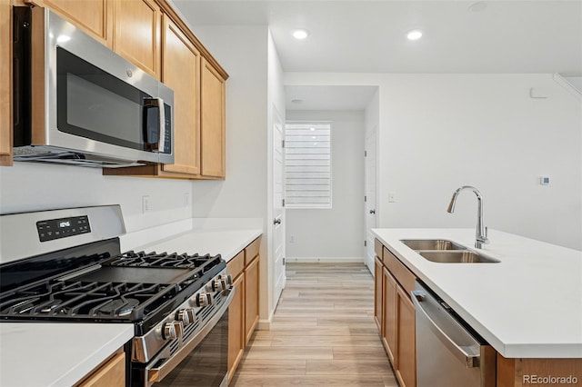 2116 Chambers Rd, Brighton, CO 80601 - kitchen with light countertops, recessed lighting, a sink, light wood-style floors, and stainless steel appliances