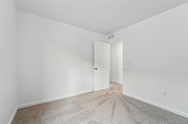 2116 Chambers Rd, Brighton, CO 80601 - carpeted empty room with baseboards and visible vents