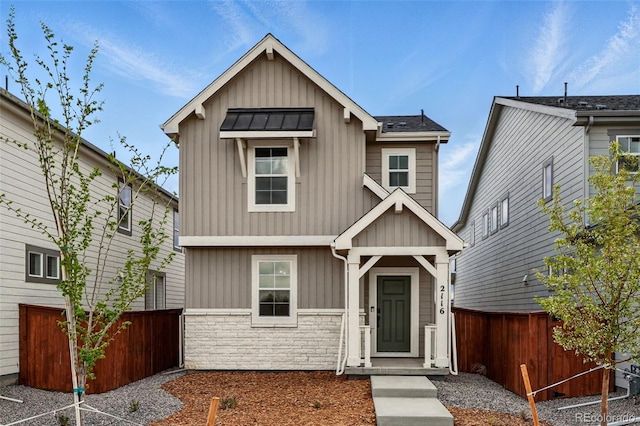2116 Chambers Rd, Brighton, CO 80601 - craftsman-style home featuring board and batten siding, stone siding, and fence
