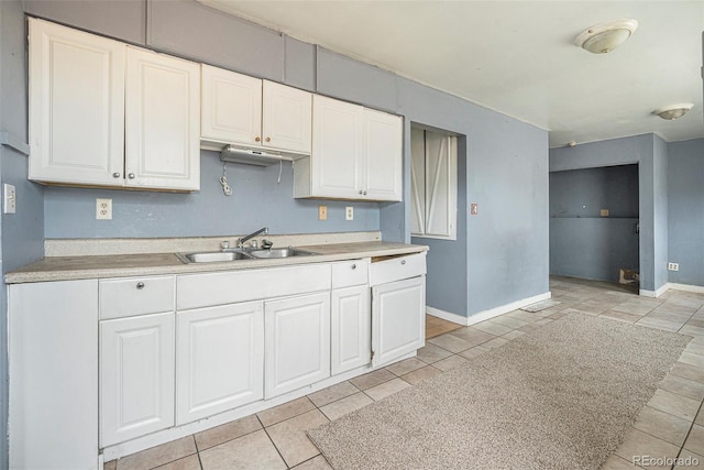 2280 S Decatur St, Denver, CO 80219 - kitchen with a sink, white cabinetry, and light countertops