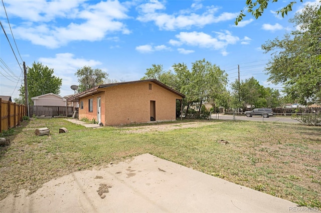 2280 S Decatur St, Denver, CO 80219 - view of side of home with a patio and stucco siding