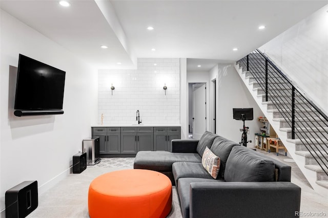 carpeted living room featuring indoor wet bar