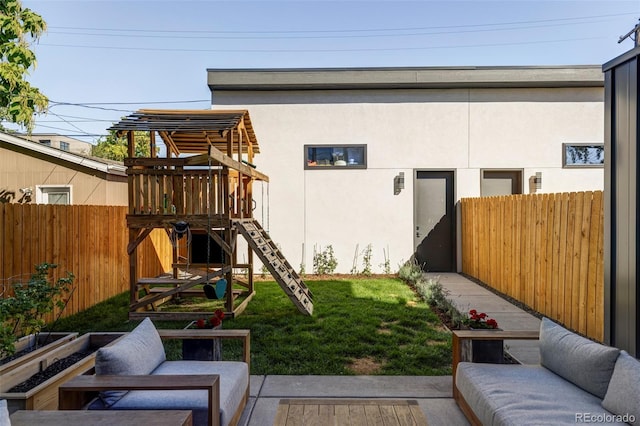 view of yard featuring a playground and an outdoor hangout area