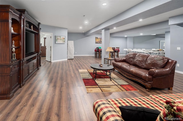 living area with recessed lighting, baseboards, and dark wood-style floors