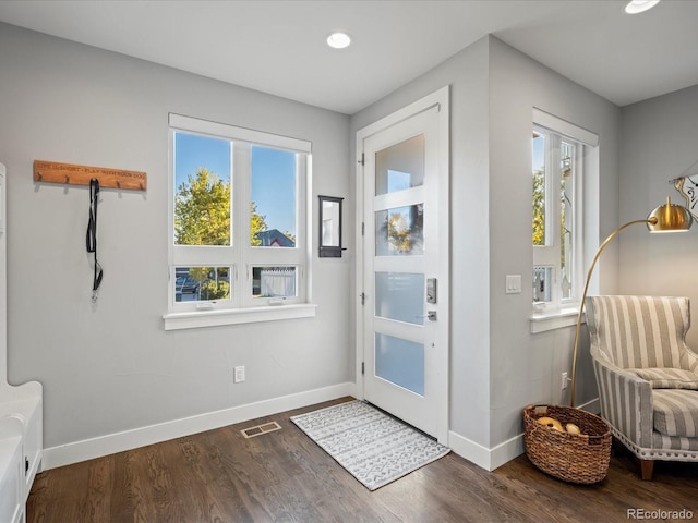 doorway to outside with dark hardwood / wood-style floors