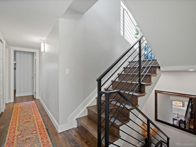 stairs with wood-type flooring