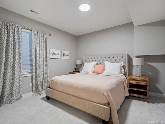 bedroom with light colored carpet