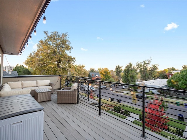 wooden terrace featuring an outdoor living space