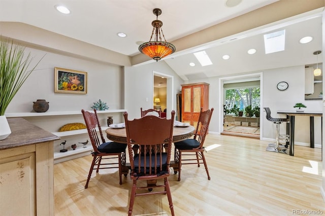 901 S Leyden St, Denver, CO 80224 - dining area with a skylight, lofted ceiling, light wood-style flooring, and recessed lighting