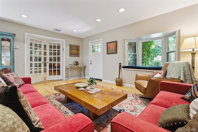 901 S Leyden St, Denver, CO 80224 - living room featuring wood finished floors, recessed lighting, and french doors