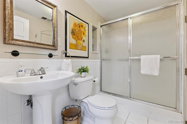 901 S Leyden St, Denver, CO 80224 - full bath featuring tile walls, a wainscoted wall, and tile patterned flooring