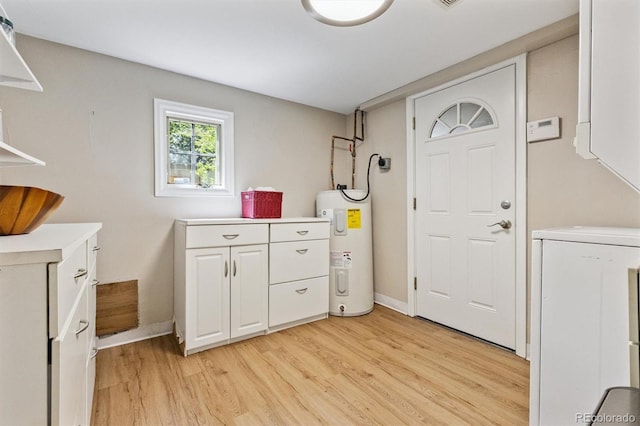 901 S Leyden St, Denver, CO 80224 - laundry area featuring water heater, washer / clothes dryer, and light wood-style floors