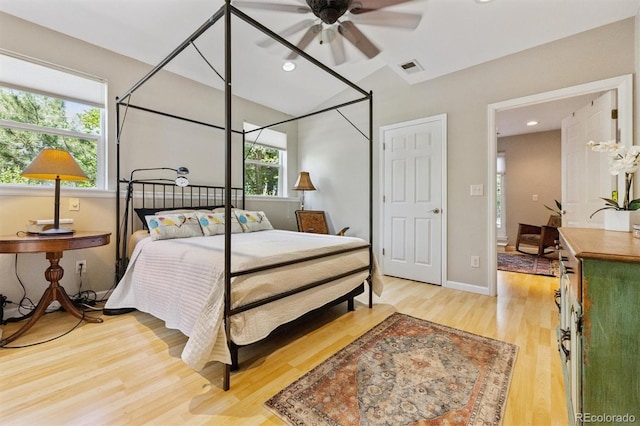 901 S Leyden St, Denver, CO 80224 - bedroom featuring light wood-type flooring, vaulted ceiling, and recessed lighting