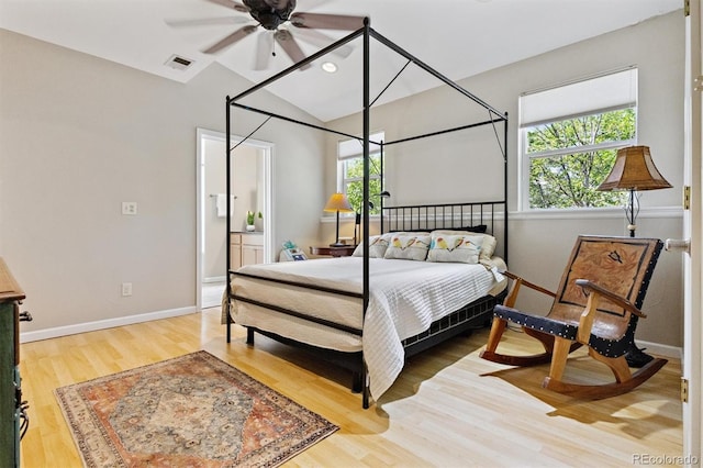 901 S Leyden St, Denver, CO 80224 - bedroom featuring wood finished floors and vaulted ceiling