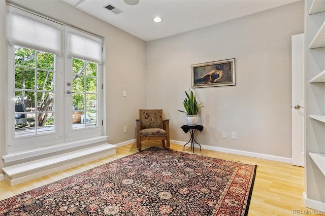 901 S Leyden St, Denver, CO 80224 - living area featuring wood finished floors and recessed lighting