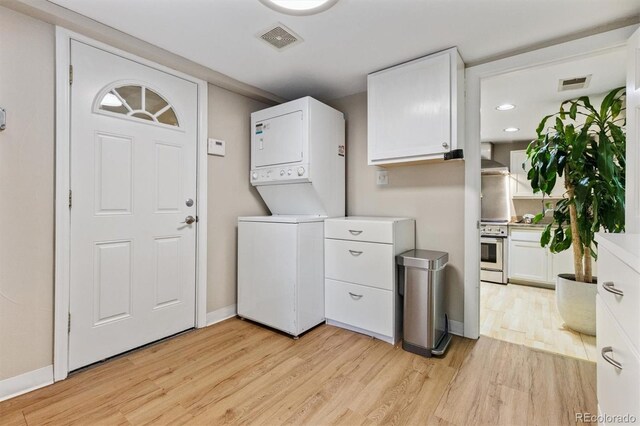 901 S Leyden St, Denver, CO 80224 - laundry area with stacked washer / dryer, light wood-style flooring, and recessed lighting