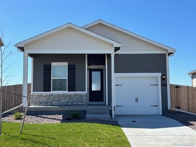 2320 Christina St, Fort Lupton, CO 80621 - view of front of property featuring concrete driveway, an attached garage, fence, and a front yard