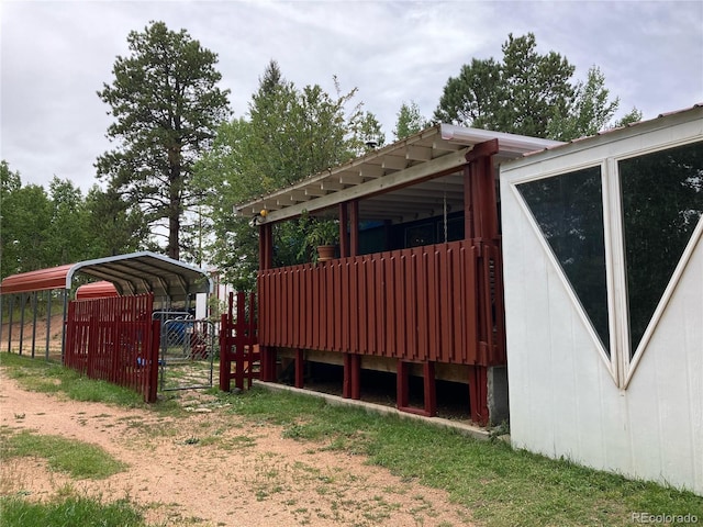 view of side of property with a carport