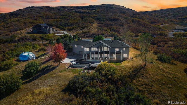 birds eye view of property with a mountain view