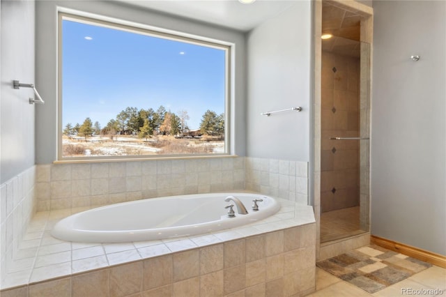 full bathroom featuring tile patterned floors, a bath, and tiled shower