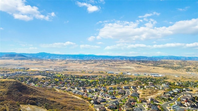 drone / aerial view featuring a residential view and a mountain view