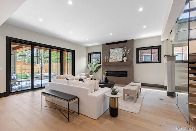 1100 S Elizabeth St, Denver, CO 80210 - living area featuring recessed lighting, a large fireplace, baseboards, and light wood-type flooring