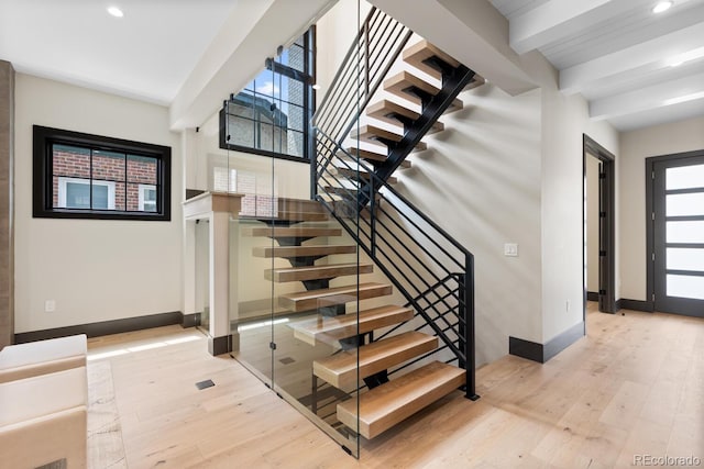 1100 S Elizabeth St, Denver, CO 80210 - stairs featuring baseboards, beamed ceiling, recessed lighting, and wood finished floors