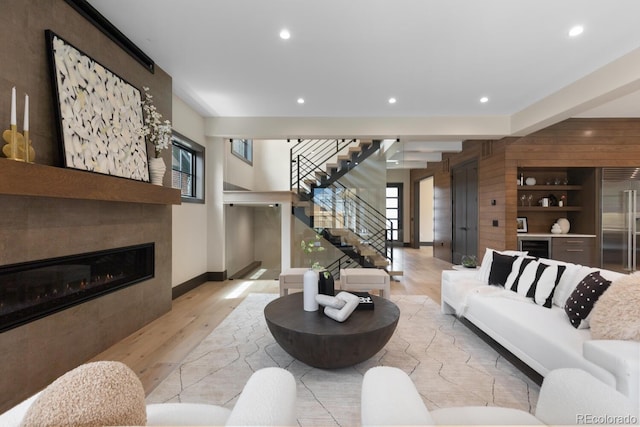 1100 S Elizabeth St, Denver, CO 80210 - living area with recessed lighting, a healthy amount of sunlight, wood finished floors, and stairway