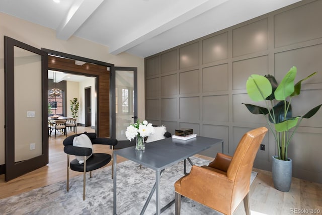 1100 S Elizabeth St, Denver, CO 80210 - dining room with light wood-style flooring, a decorative wall, and beam ceiling