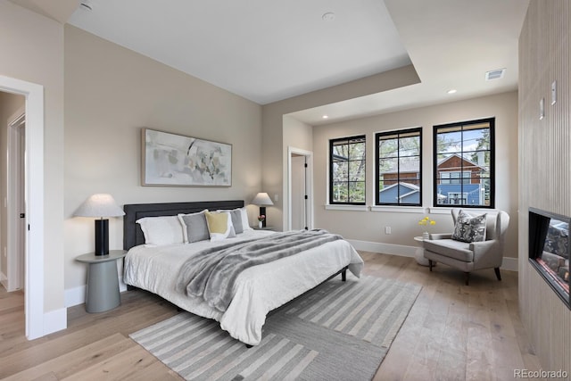1100 S Elizabeth St, Denver, CO 80210 - bedroom with light wood-style floors, baseboards, recessed lighting, and visible vents