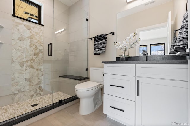 1100 S Elizabeth St, Denver, CO 80210 - bathroom featuring tile patterned floors, a shower stall, toilet, and visible vents