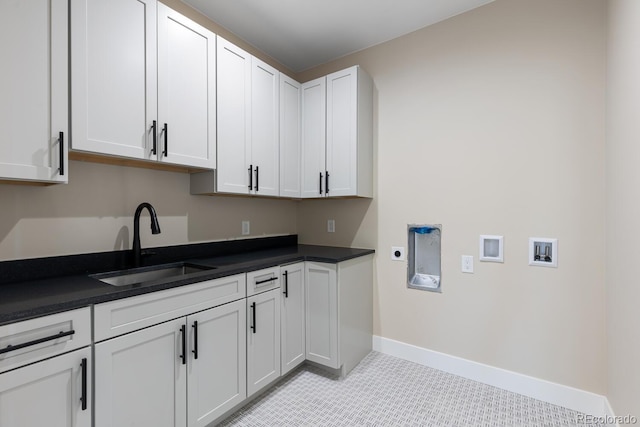 1100 S Elizabeth St, Denver, CO 80210 - washroom featuring cabinet space, a sink, hookup for a washing machine, baseboards, and hookup for an electric dryer