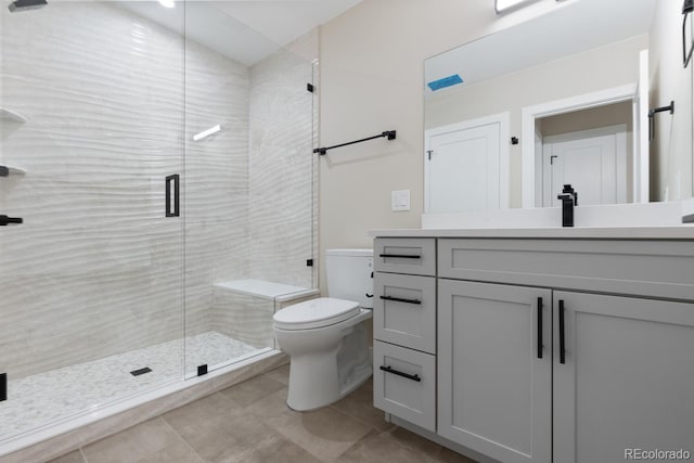 1100 S Elizabeth St, Denver, CO 80210 - bathroom with toilet, a shower stall, tile patterned flooring, and vanity
