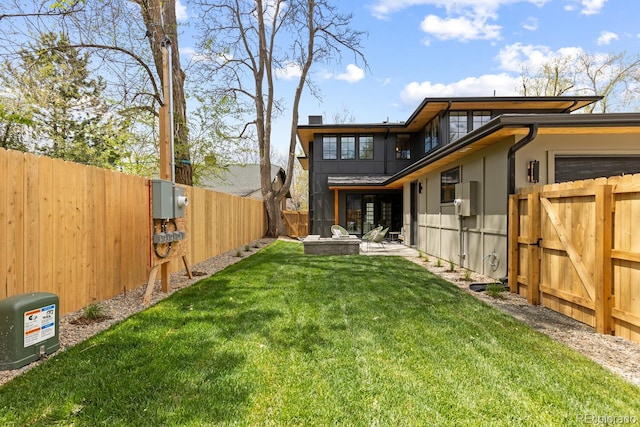 1100 S Elizabeth St, Denver, CO 80210 - rear view of house with a yard, a gate, and a fenced backyard