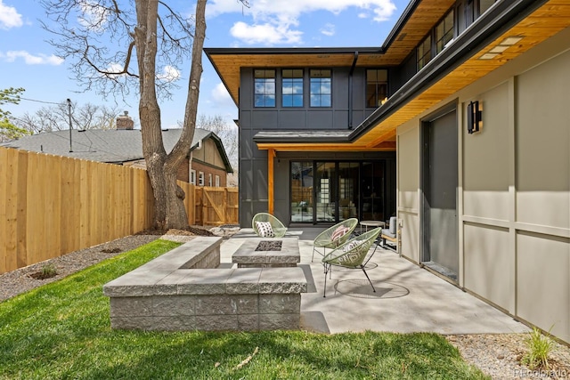 1100 S Elizabeth St, Denver, CO 80210 - rear view of property featuring a patio, a fire pit, and a fenced backyard