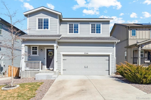 traditional-style house with a garage and driveway