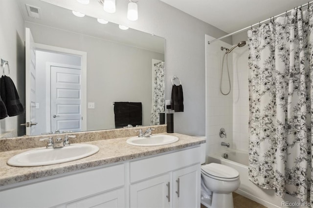 full bath with double vanity, shower / tub combo, visible vents, and a sink