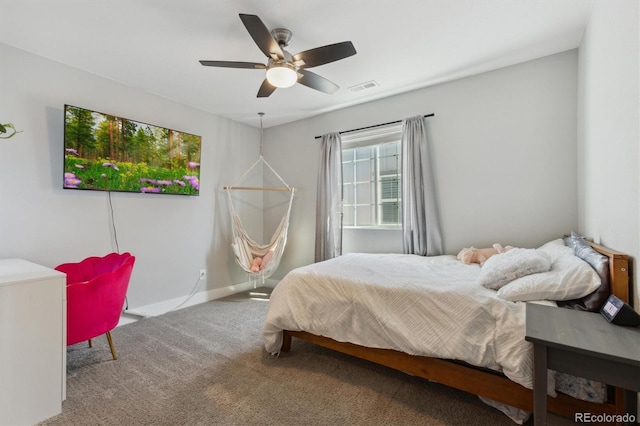 bedroom featuring visible vents, carpet floors, baseboards, and a ceiling fan